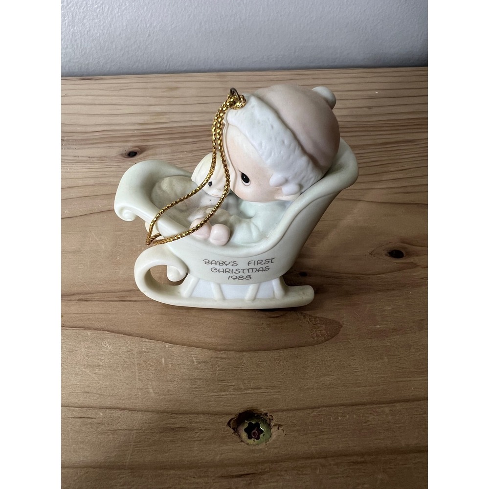 Precious Moments "Baby's First Christmas" ornament from 1988.